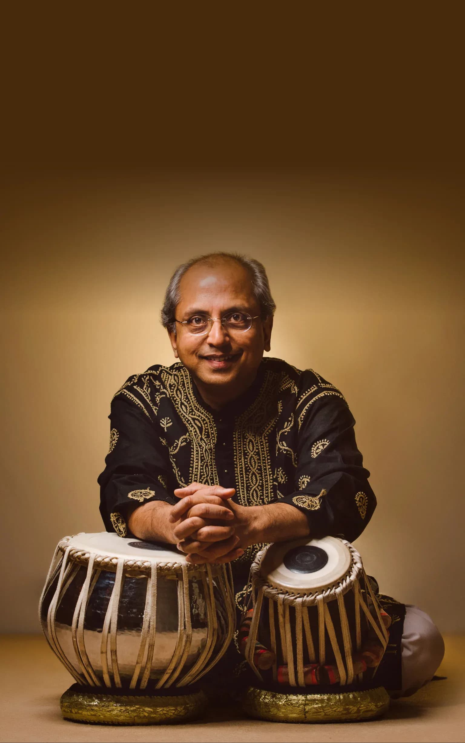 Yogesh Samsi sitting with his tabla