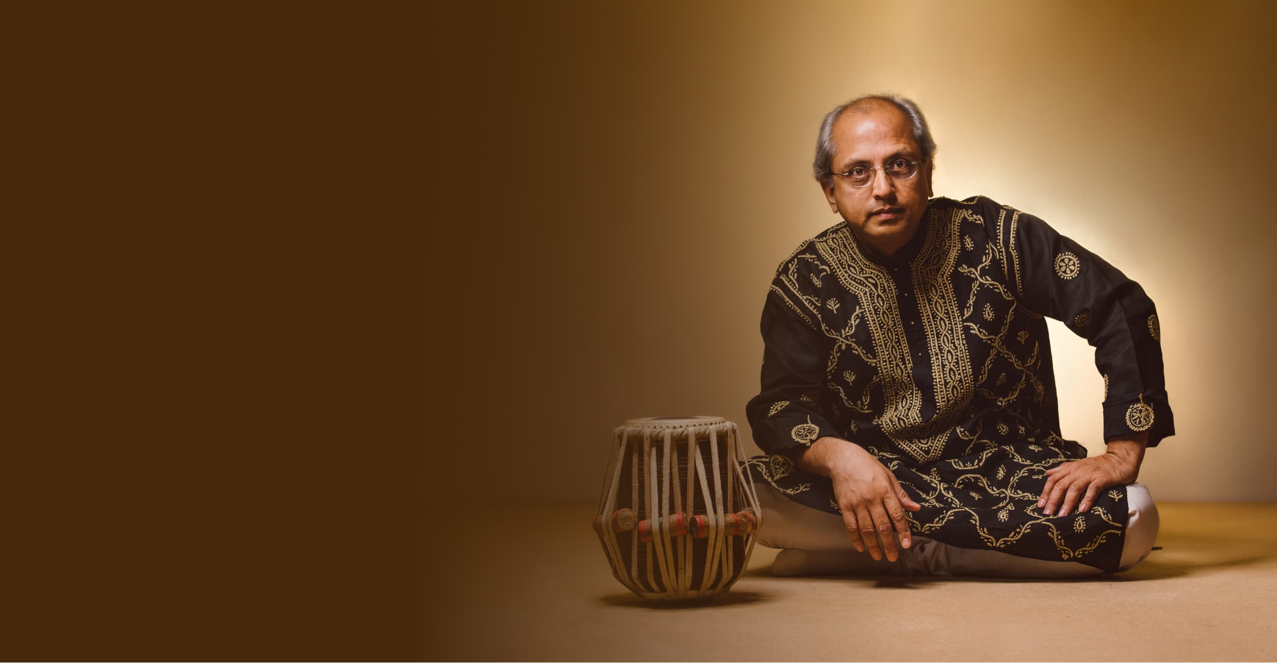Yogesh Samsi sitting with his tabla